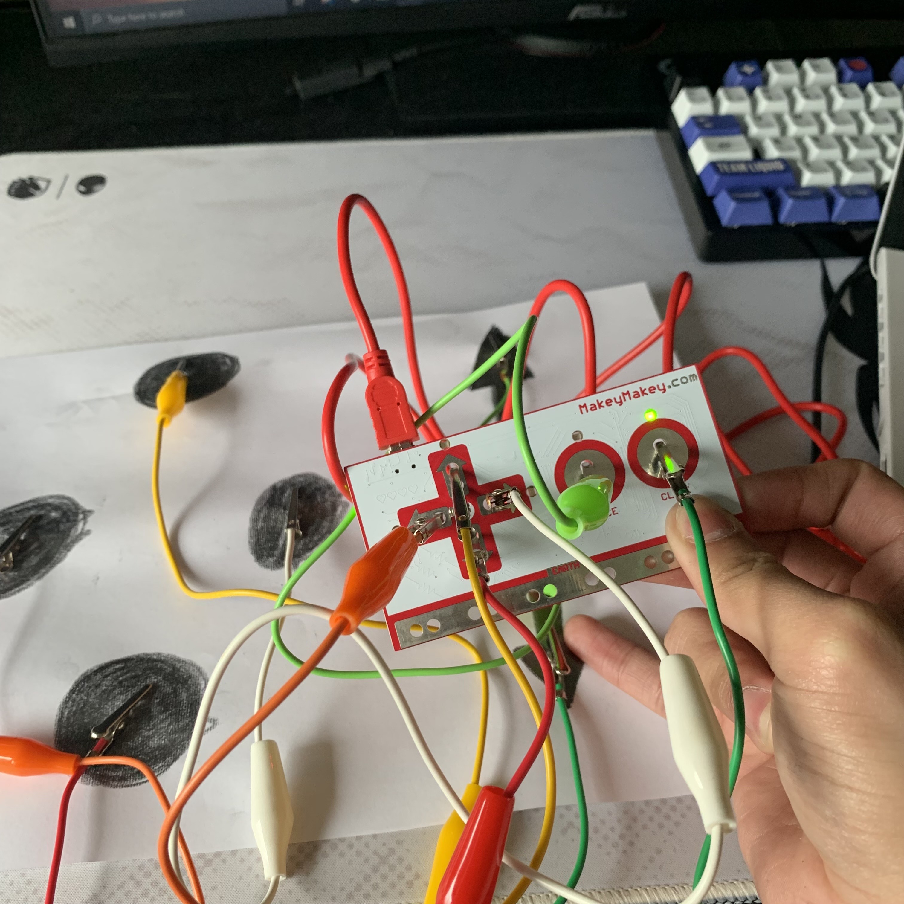 Drawn graphite pencil and hand connection circuit works.