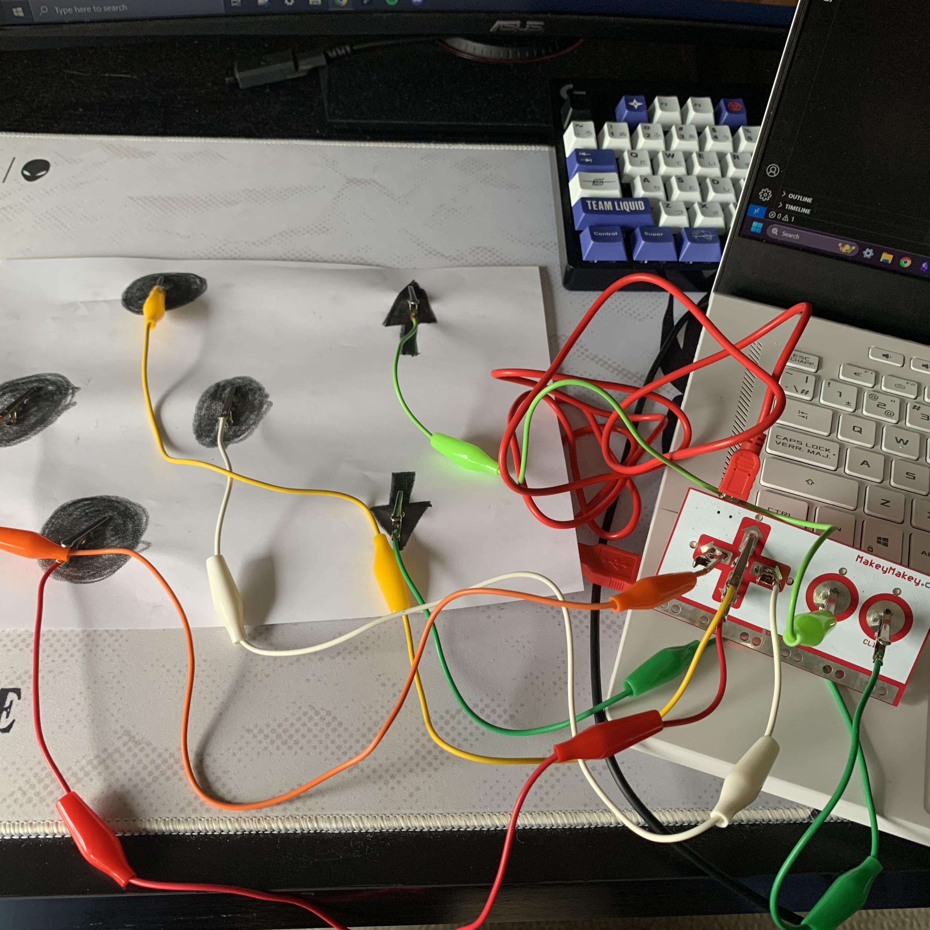 Full image of the drawn graphite controller using paper and alligator clips.