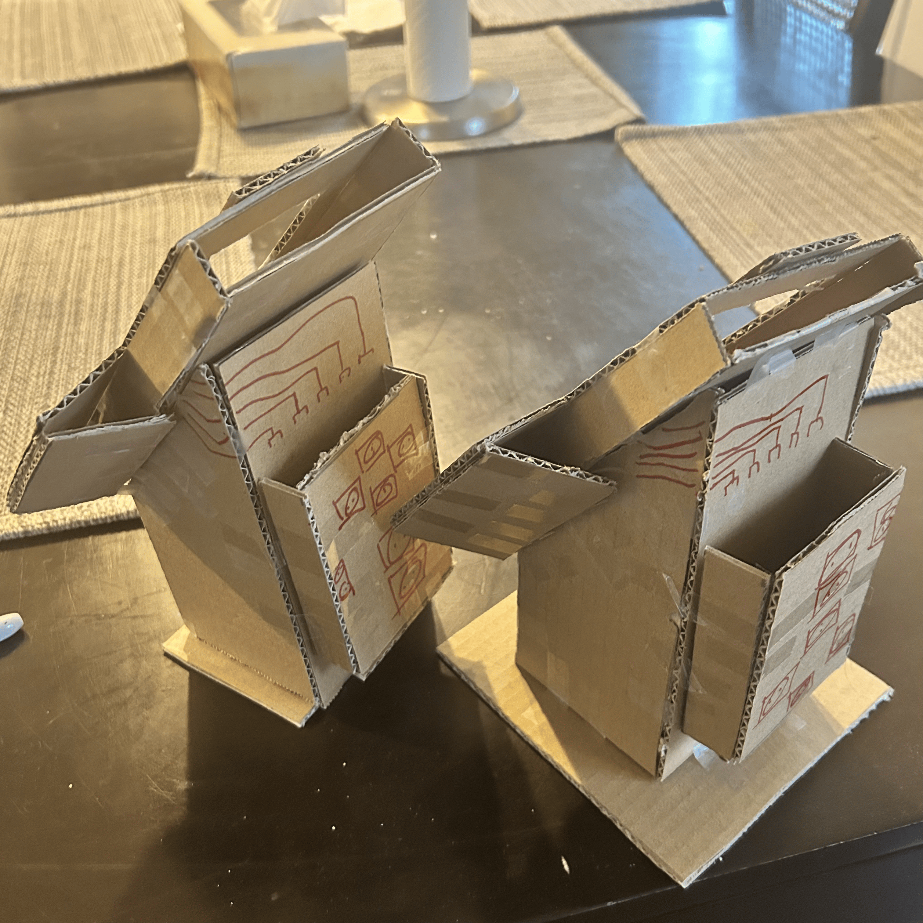 Sketched lines to display an example of how the wires being connected to the makey makey will enable interactions when a user presses the buttons from the front of the kiosks.
